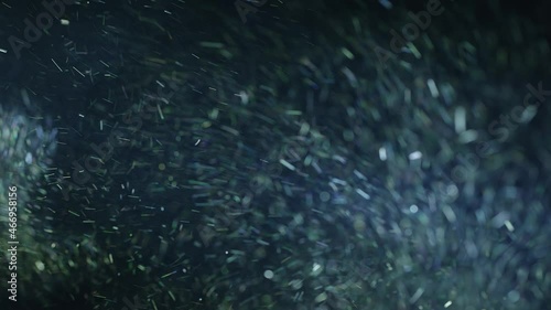 Natural Dust Organic Floating particles in stage light ray (spot) on black background. Dust in air atmosphere for your projects! Just drop it over your footage and use blending (screen) mode.