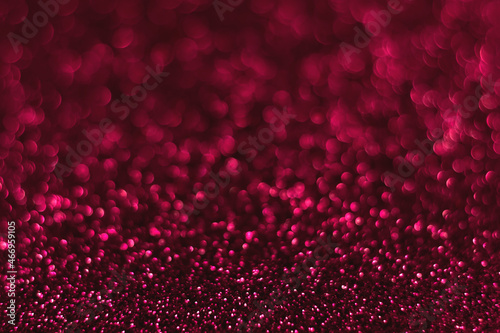Pink sparkling glitter bokeh background  christmas abstract defocused texture. Holiday lights