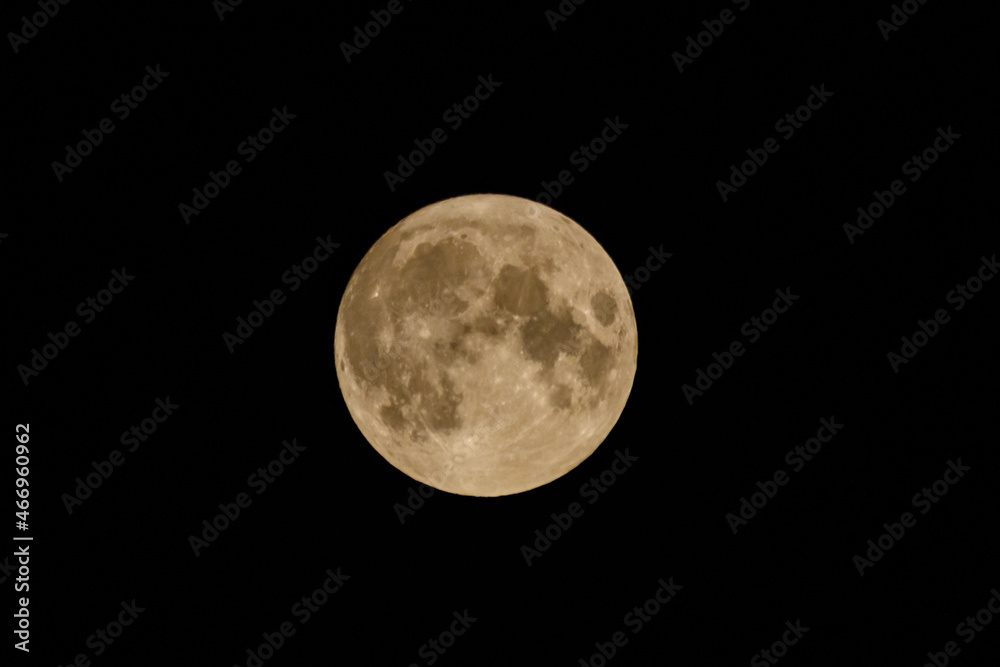 Full moon in a black sky. Astronomy concept Full moon in a black sky. Astronomy concept