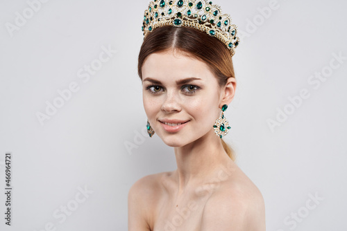 beautiful woman with a crown on her head makeup model