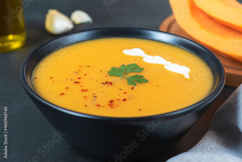 A bowl of delicious creamy pumpkin soup.