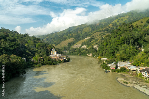 Natural landscape with a view of the Cauca river and blue sky. Puerto Valdivia, Antioquia, Colombia. © camaralucida1