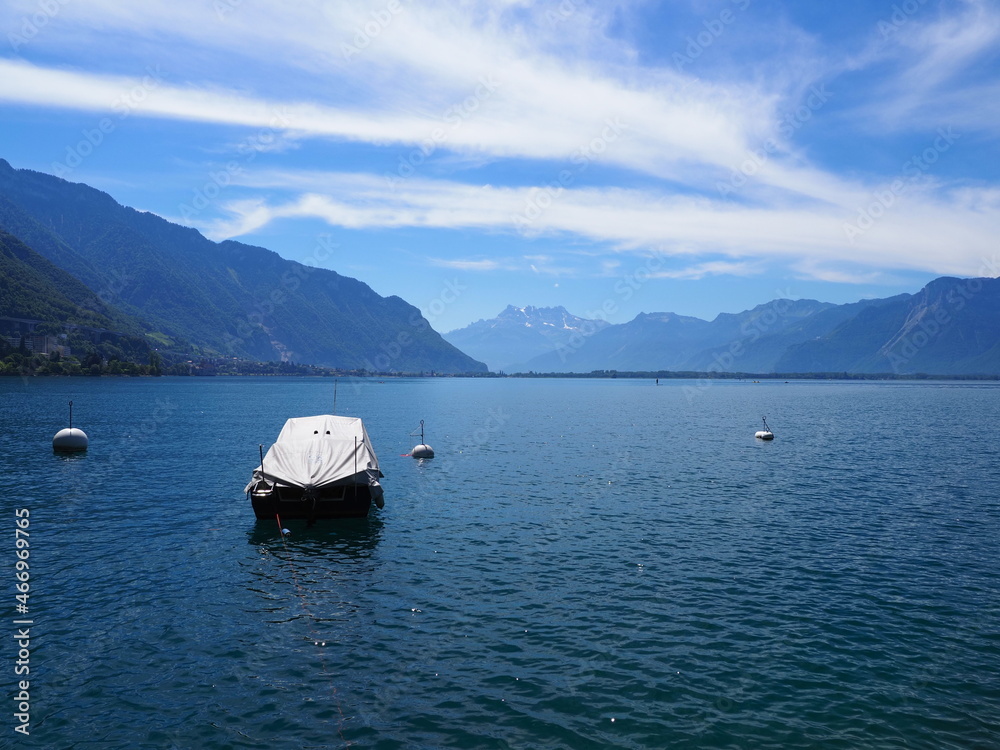 Covered boat on Lake Geneva at Montreux city in Switzerland Covered boat on Lake Geneva at Montreux city in Switzerland