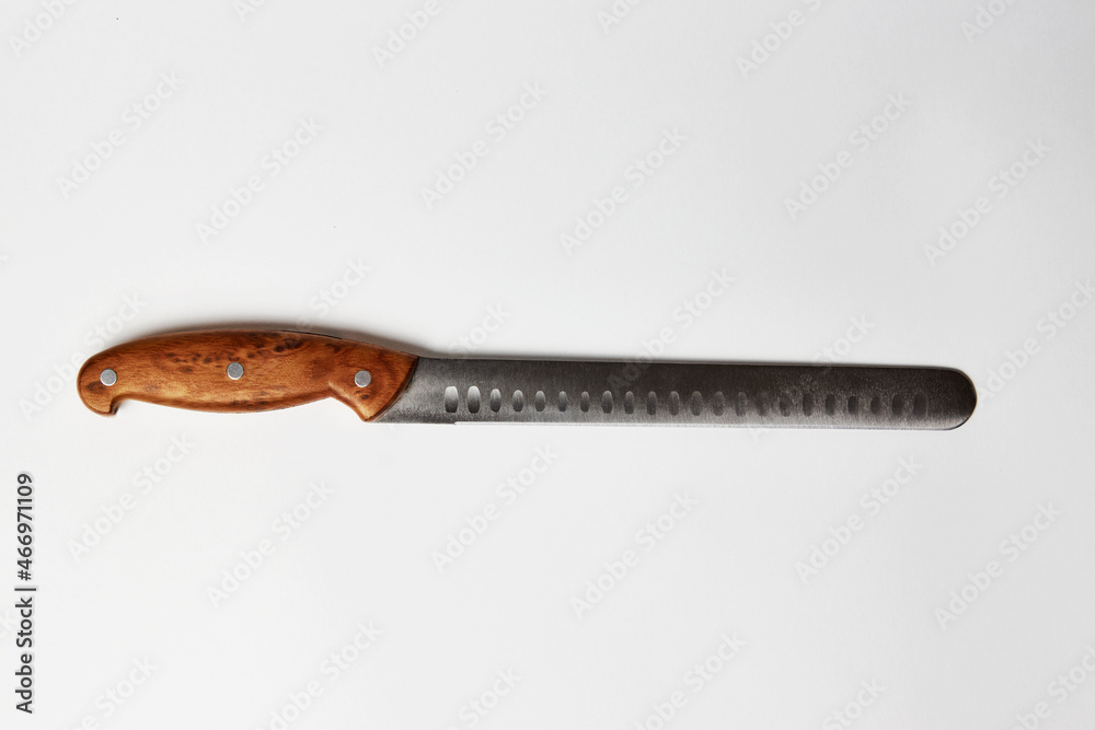 Ham slicer knife on white background with copy space Ham slicer knife on white background with copy space