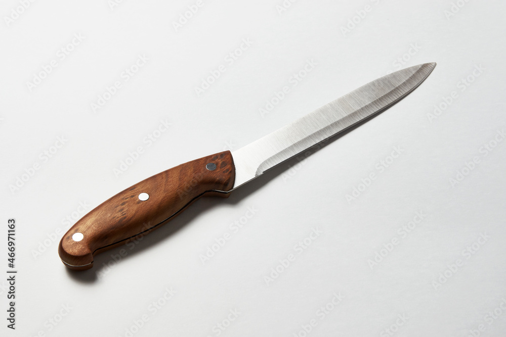 Fototapeta premium Kitchen knife on white background with copy space