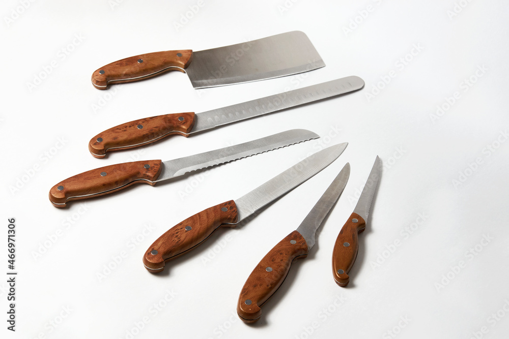 Fototapeta premium Kitchen knives on white background. Set of steel knives