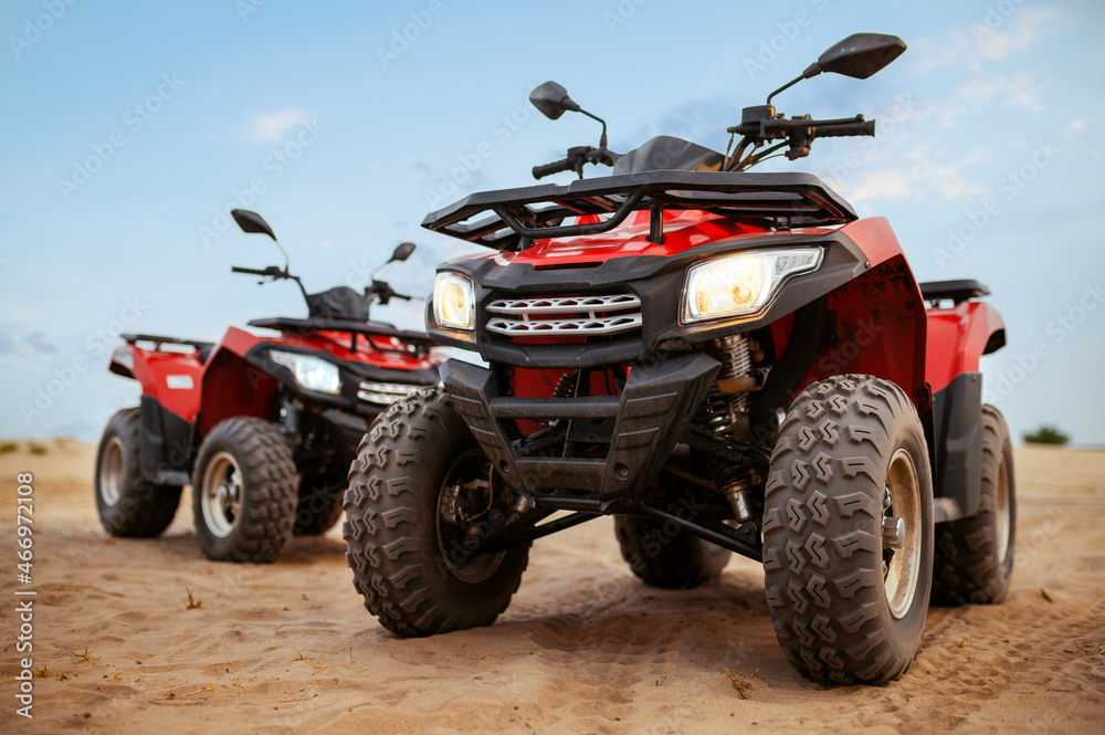Two atvs in desert, quadbikes closeup, nobody Two atvs in desert, quadbikes closeup, nobody