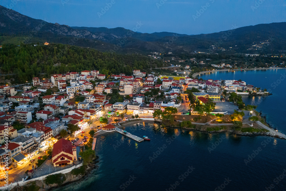 Aerial evening view of Neos Marmaras city, marina, port. Greece, Sithonia peninsula of Halkidiki	