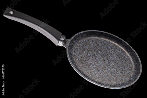 Grey frying pan with non-stick, isolated on black background