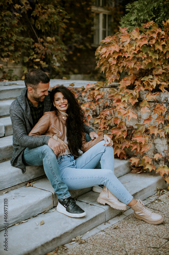 Young couple smiling and talking at outdoor on autumn day