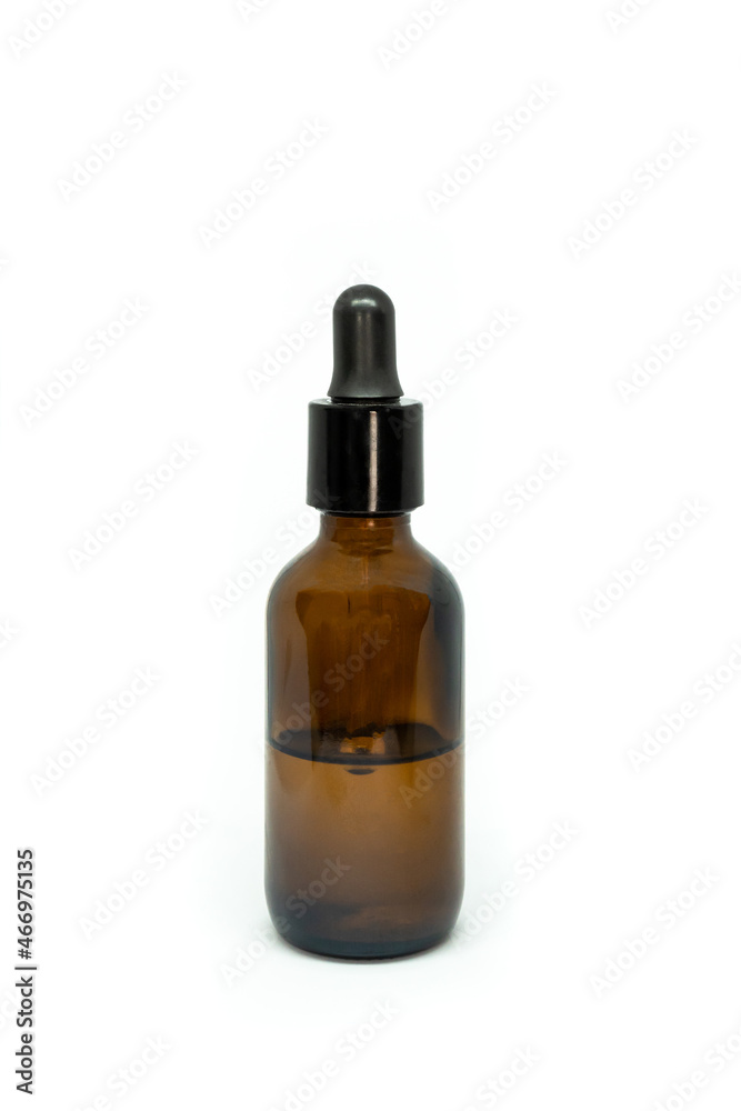 opaque bottle with dropper for medical or aesthetic products such as essential oils or medicine isolated on white background.