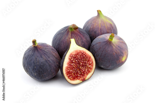 Fig fruit with ripe red halves isolated on white