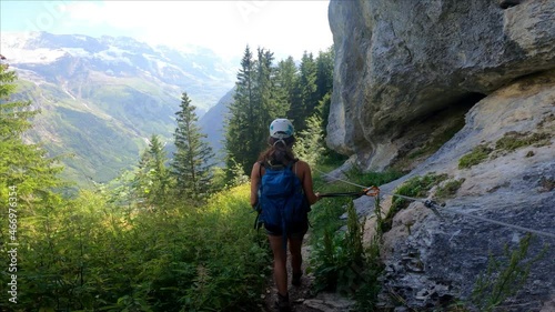 Via Ferrata from Murren to Gimmelwald. Risky rock climbing on Swiss Alps. photo