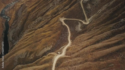 Katu Yaryk mountain pass in the valley of the Chulyshman River, Altai, Siberia, Russia. A dangerous empty serpentine highway, a huge stone gorge, a canyon, a mountain winding river. Freedom