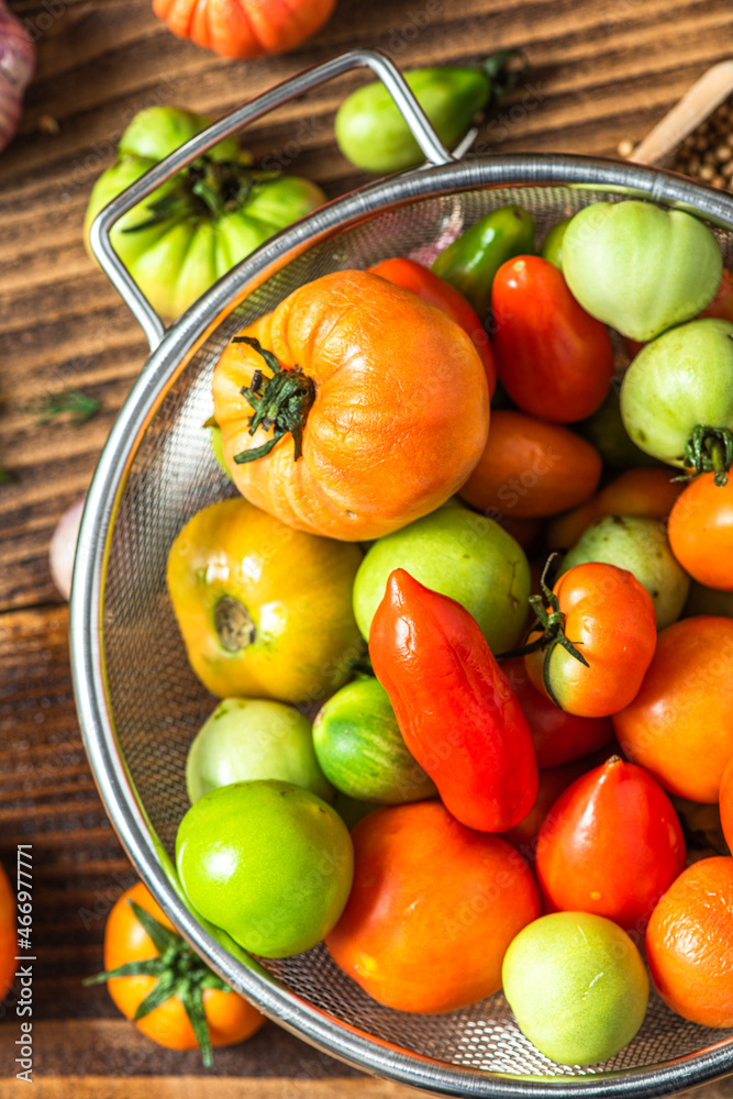 Colorful Ripe Tomatoes on Wooden Table Colorful Ripe Tomatoes on Wooden Table