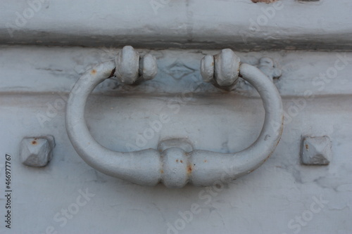 Vintage brass door knocker on an old door, Italy, Rome