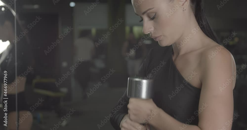 Young woman doing sports exercises with dumbbells. Hobby and lifestyle
