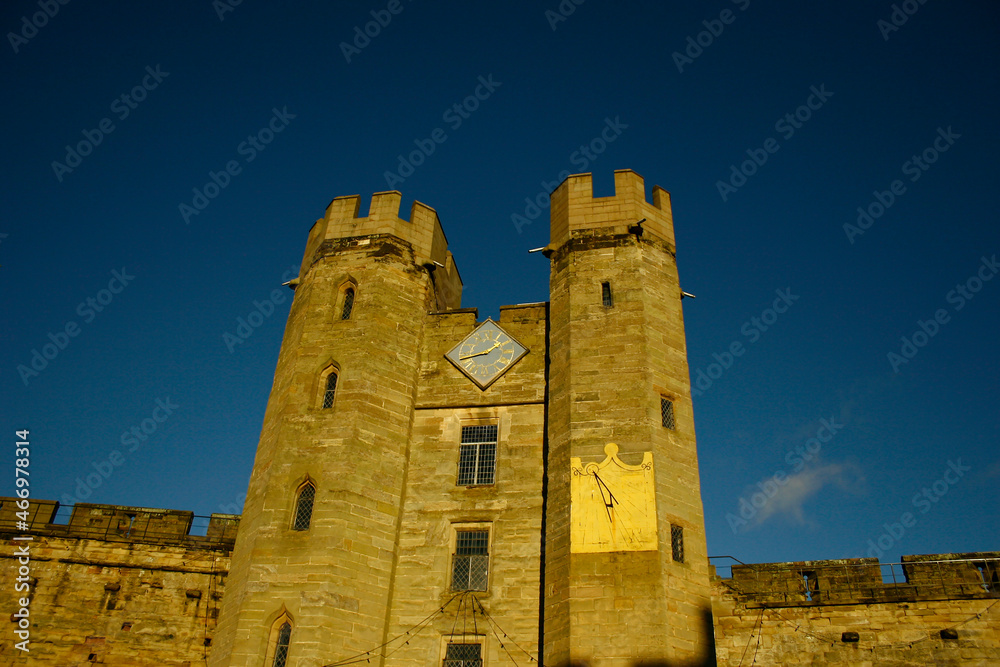 old British Castle in warwick westmidlands in golden autumn light with the blue sky background during autumn
