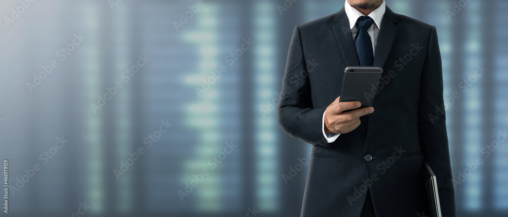 Hand holding smartphone device and touching screen. Stock exchange market concept Hand holding smartphone device and touching screen. Stock exchange market concept