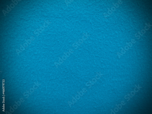Felt light blue soft rough textile material background texture close up,poker table,tennis ball,table cloth. Empty light blue fabric background.
