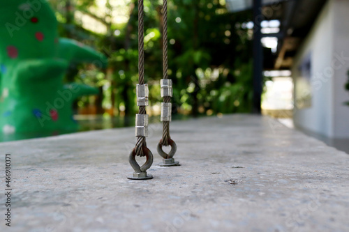 Fotografie Close-up view of vertical sling embedded in cement floor for strong adhesion to the structure
