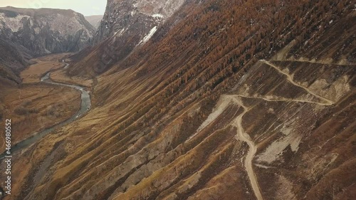 Katu Yaryk mountain pass in the valley of the Chulyshman River, Altai, Siberia, Russia. A dangerous empty serpentine highway, a huge stone gorge, a canyon, a mountain winding river. Freedom
