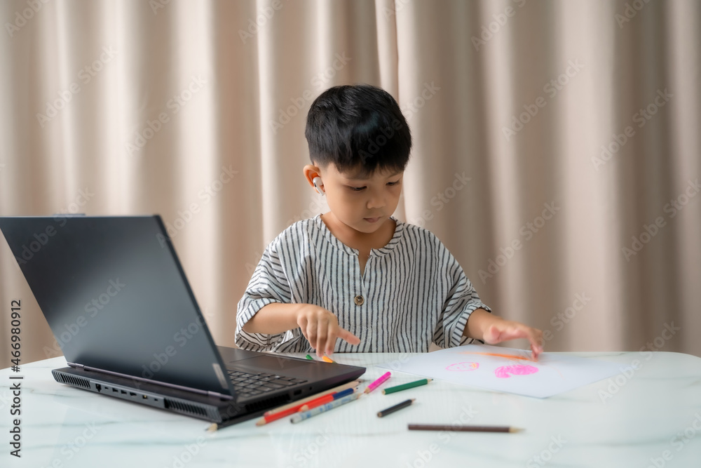 Distance Education,Child is sitting at desk,Boy doing homework or online education. Distance Education,Child is sitting at desk,Boy doing homework or online education.