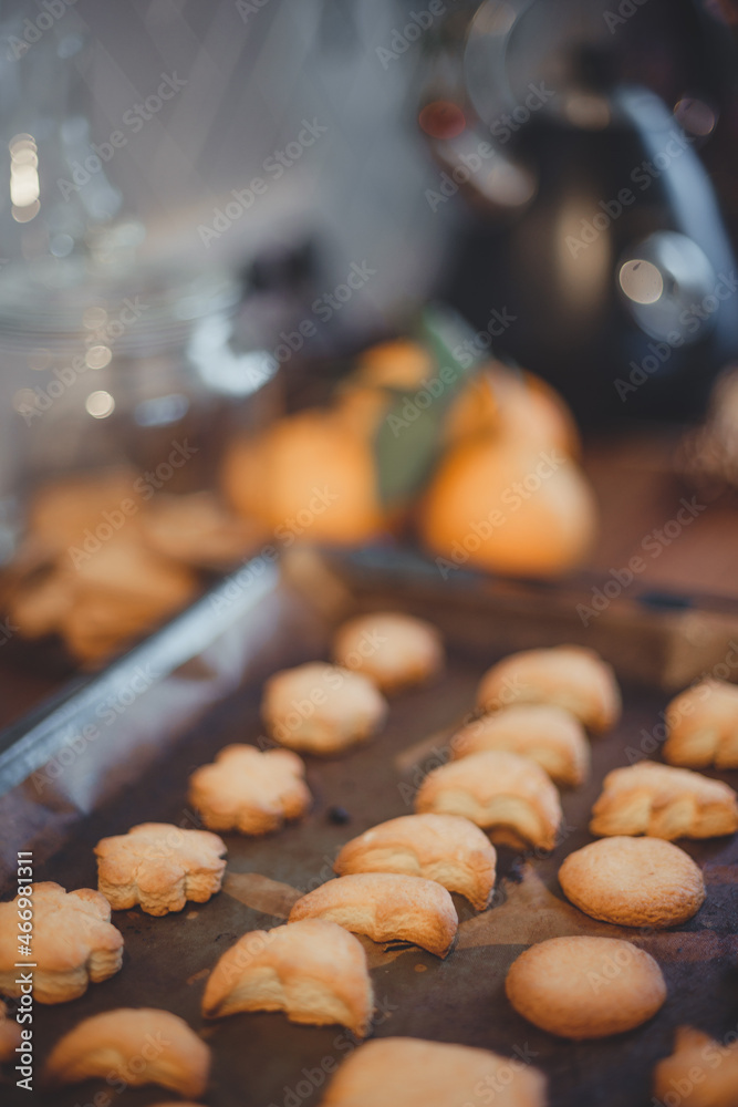 Homemade Christmas cookies on a baking sheet on a wooden table. Homemade Christmas cookies on a baking sheet on a wooden table.