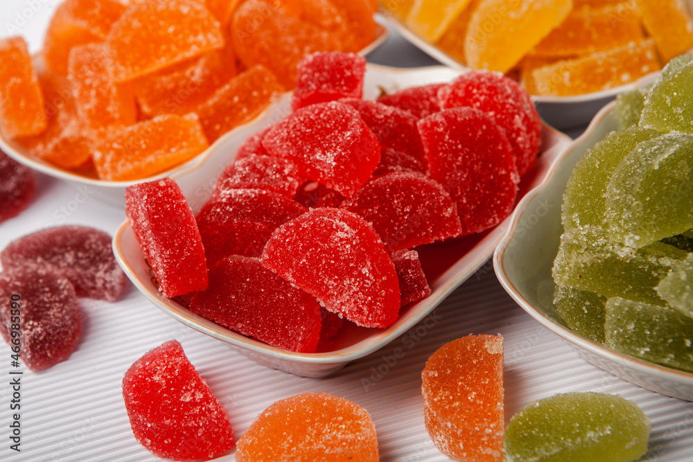 Dessert marmalade in the form of lemon and orange slices. The sweetness of jelly candy. Dessert marmalade in the form of lemon and orange slices. The sweetness of jelly candy.