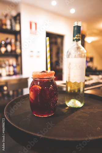 Sweet wine and coke drink on a pub bar. photo