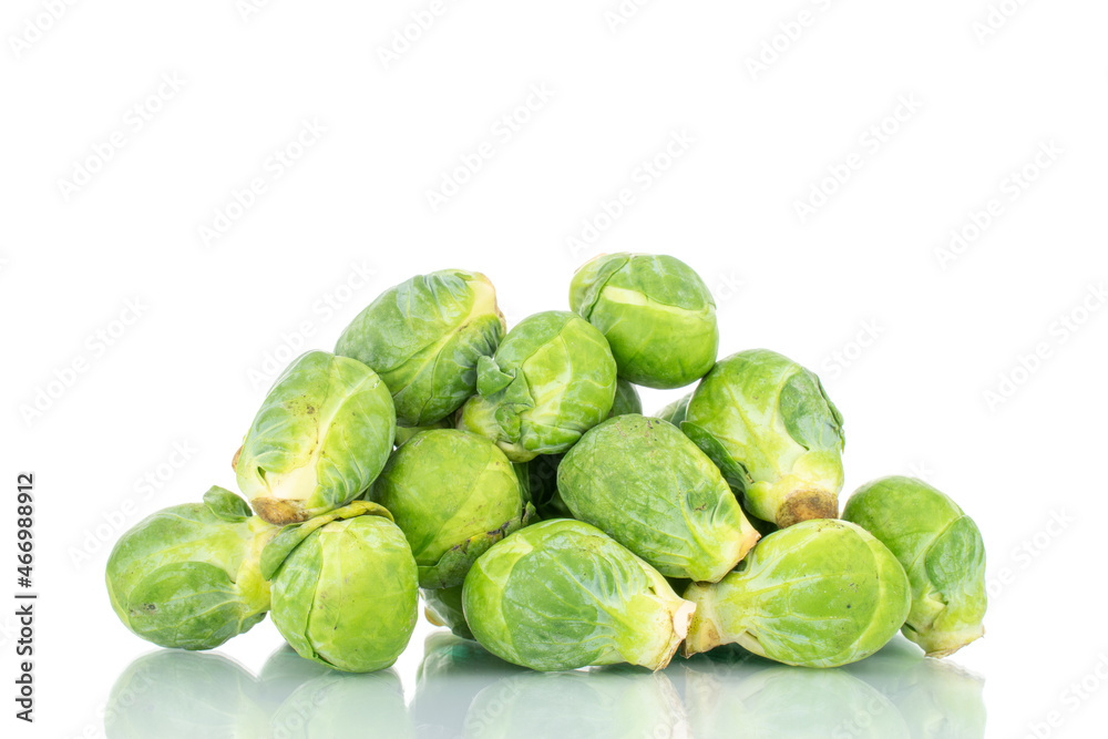 Organic ripe brussels sprouts, close-up, isolated on white.