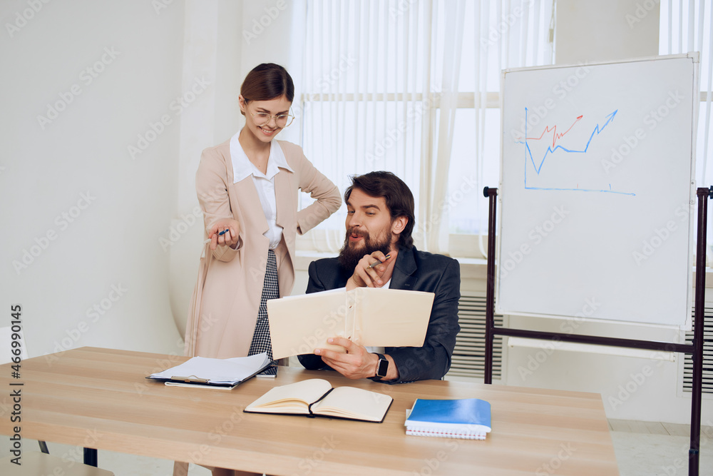 business man boss with secretary chatting in the office business man boss with secretary chatting in the office