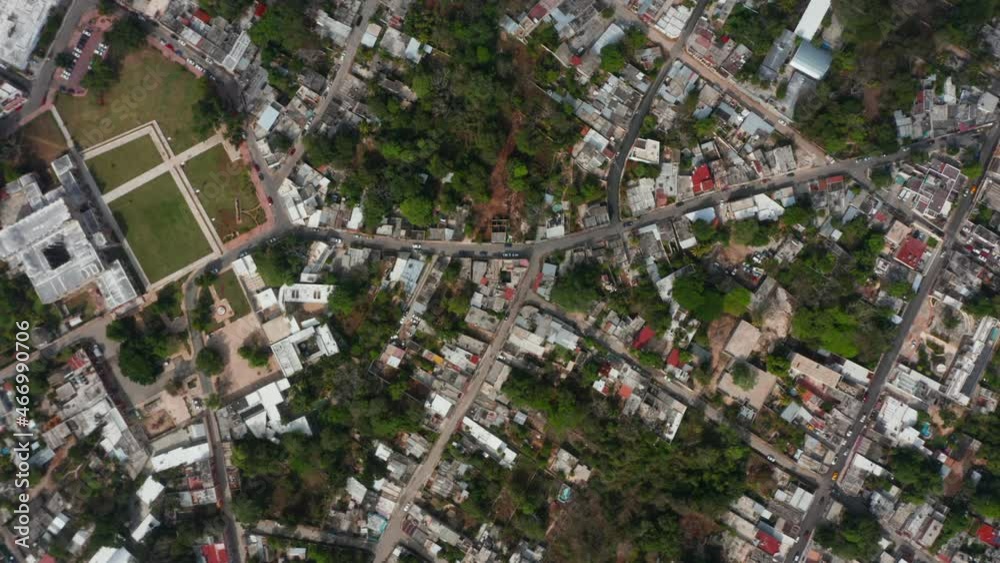 Aerial birds eye overhead top down view of town development. Houses along streets from height. Valladolid, Mexico Aerial birds eye overhead top down view of town development. Houses along streets from height. Valladolid, Mexico