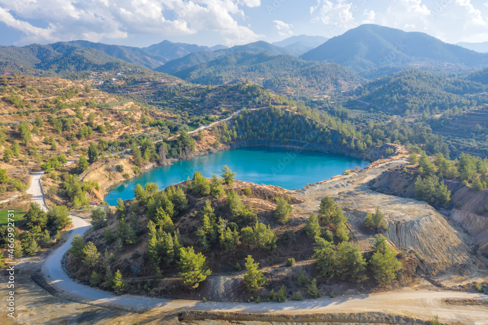 Memi lake in open pit of abandoned pyrite mine in Xyliatos, Cyprus. Ecological restoration and reforestation of old mining area