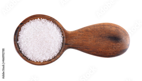Granulated sugar in wooden spoon, isolated on white background. White sugar. Top view.
