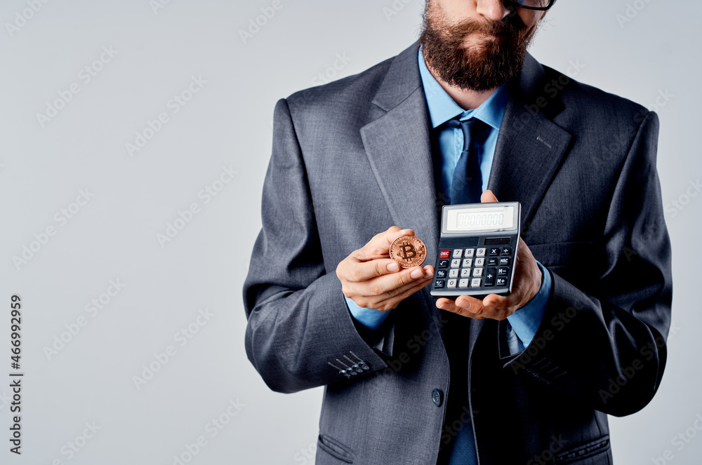 emotional man calculator bitcoin in hand counting finance studio official emotional man calculator bitcoin in hand counting finance studio official