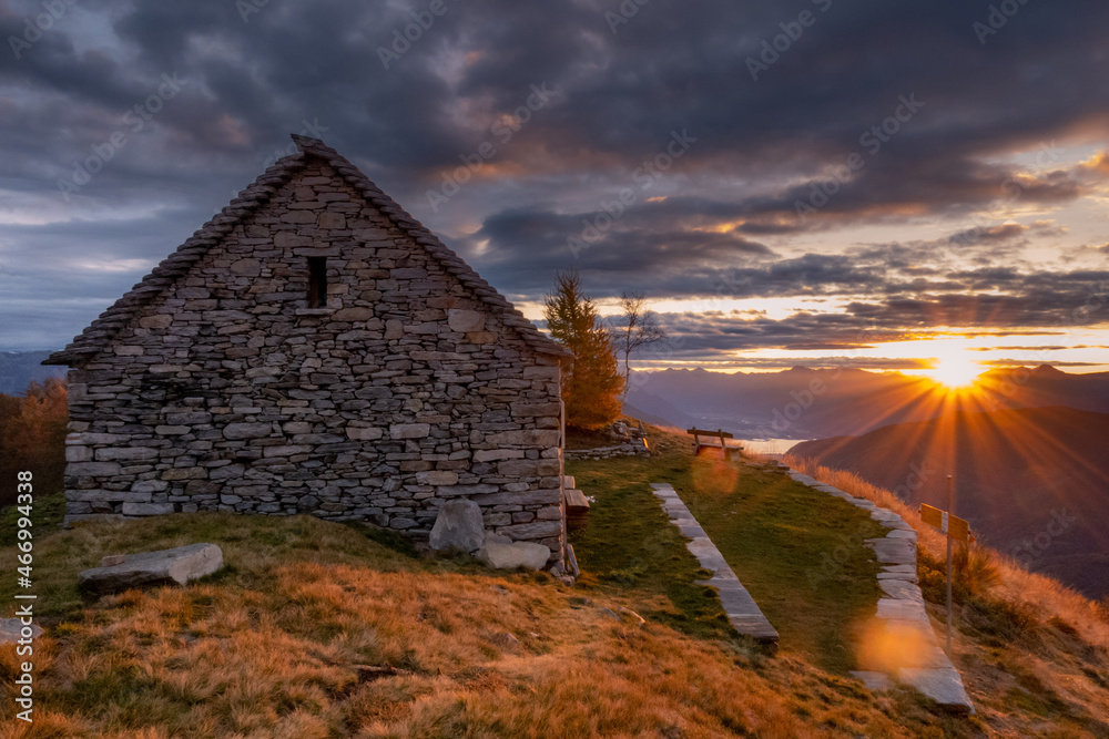 Fototapeta premium beautiful sunset from the hut on top of a mountain
