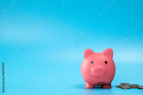 Pink Piggy Bank with stack of coins, growth and saving concept, Business and financial with copy space.