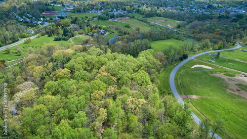 An Aerial View of Beautifully Blooming Colored Trees and Plants and Unique Structures on a Spring Day © Greg Kelton
