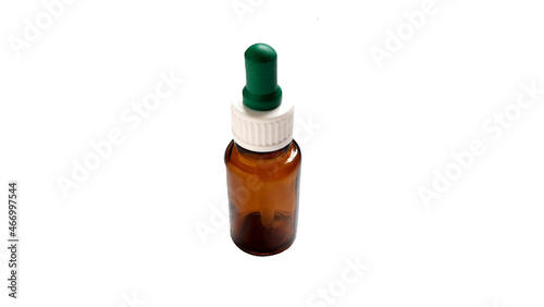 A glass medicine dropper bottle on a white background