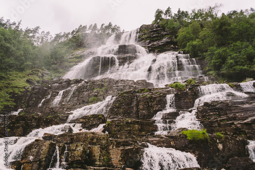 view of Tvindefossen or Tvinnefossen waterfall near Voss  Norway. Natural  landscape. Tvinde Camping. Marquee  rocks