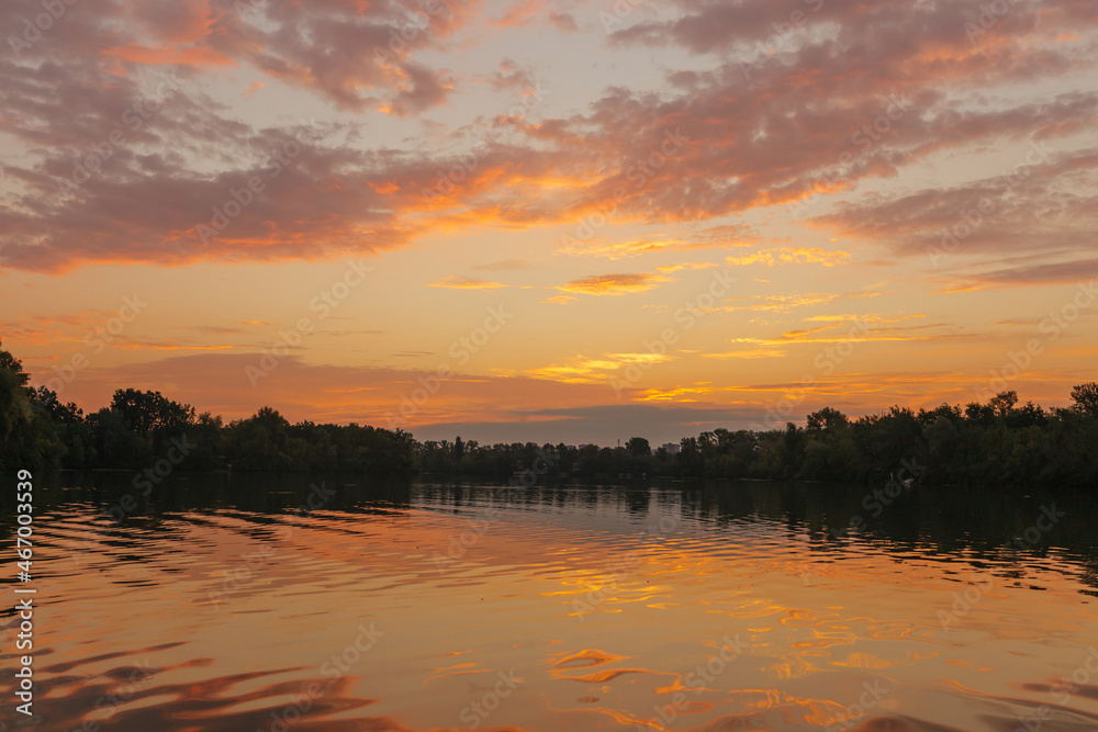 Obraz premium morning sunrise on the river with beautiful colours 