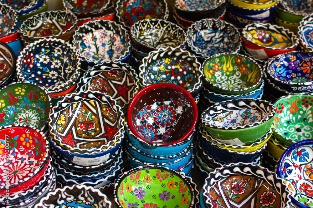 Details of Georgia: national patterns on ceramic dishes. Multicolored bowls with patterns 