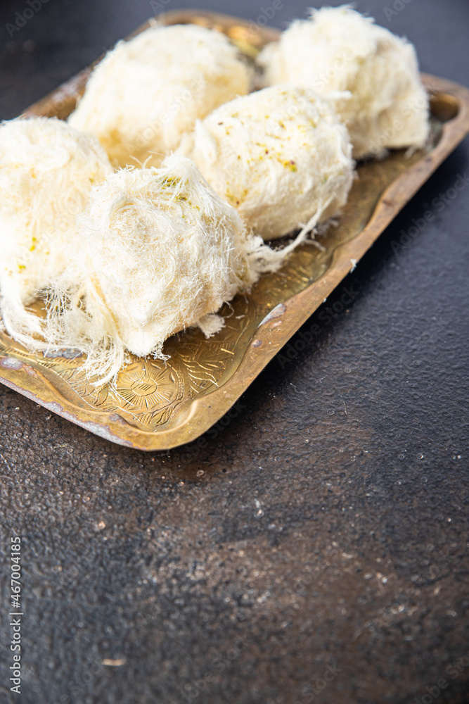 pismaniye cotton candy turkish sweet nut and pistachio dessert sweet meal snack on the table copy space food background rustic. top view