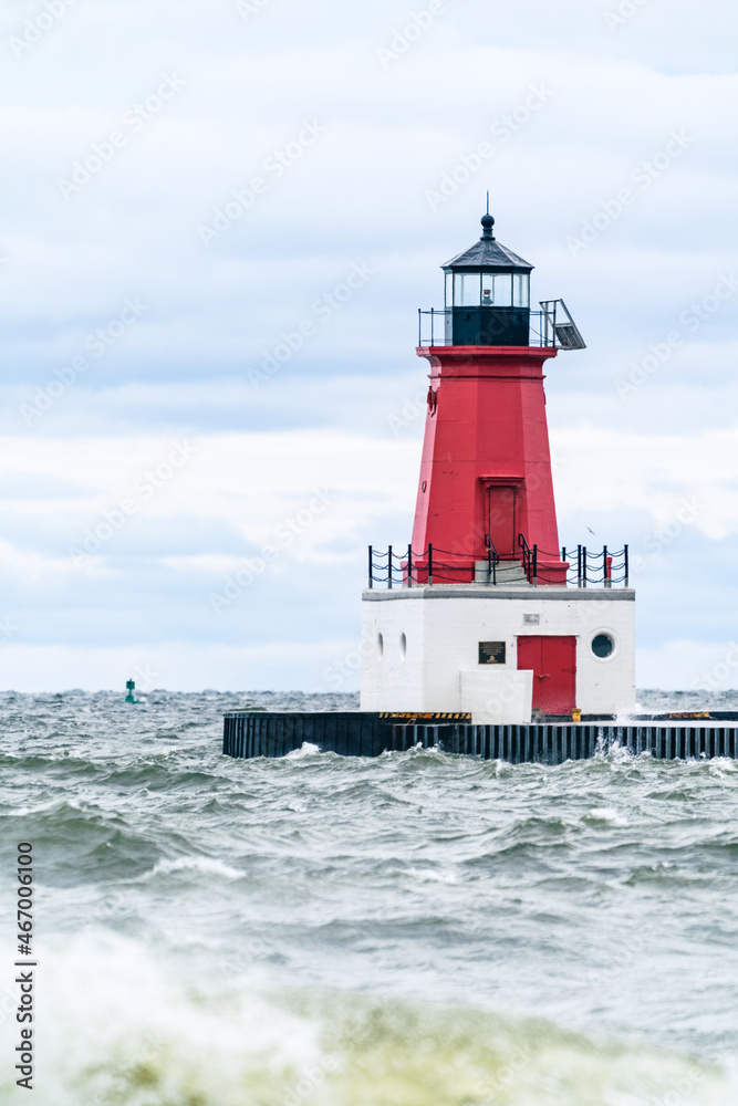 Menominee Pierhead Lighthouse at Ann Arbor Park, as choppy waves of Lake Michigan crash ashore