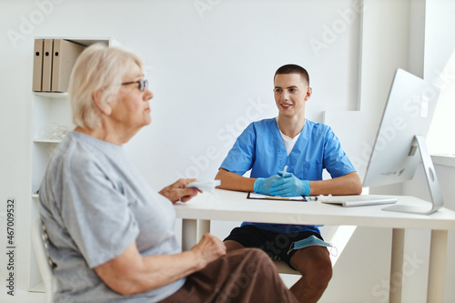 the patient sits in the doctor's office health care