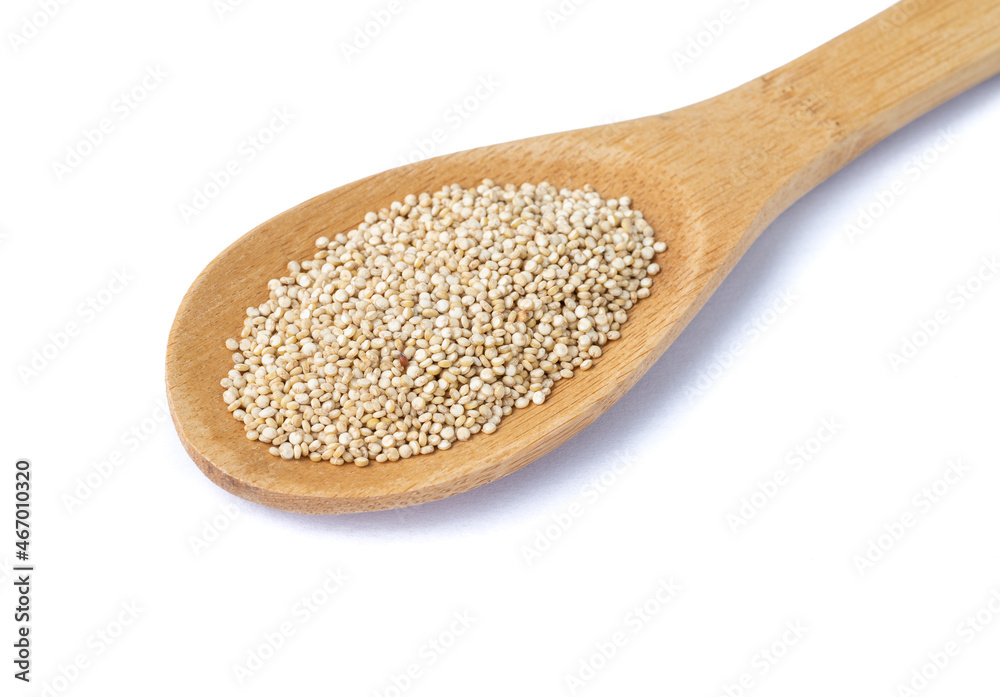 Raw quinoa grains in a spoon isolated over white background Raw quinoa grains in a spoon isolated over white background