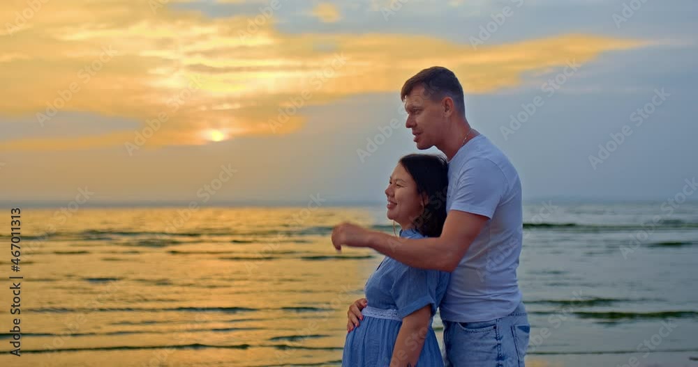 Portrait, loving man and woman talking on the seashore, they are happy. Man carefully hugs a pregnant woman, they have fun, they laugh. Waiting for the baby. Happy motherhood. 4k, ProRes Portrait, loving man and woman talking on the seashore, they are happy. Man carefully hugs a pregnant woman, they have fun, they laugh. Waiting for the baby. Happy motherhood. 4k, ProRes