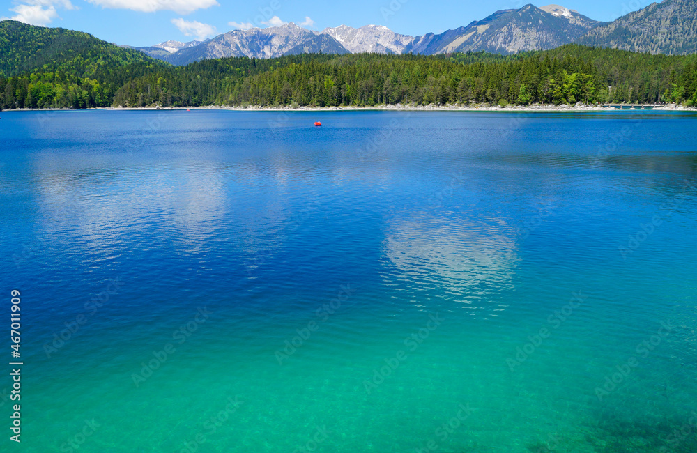 picturesque turquois alpine lake Eibsee (yew lake) by the foot of mountain Zugspitze in Bavaria (the German Alps, Garmisch-Partenkirchen, Grainau, Bavaria, Germany)	