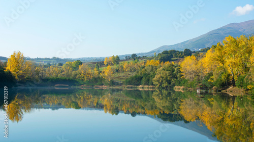 Autumn landscape with panoramic reflection on the lake.